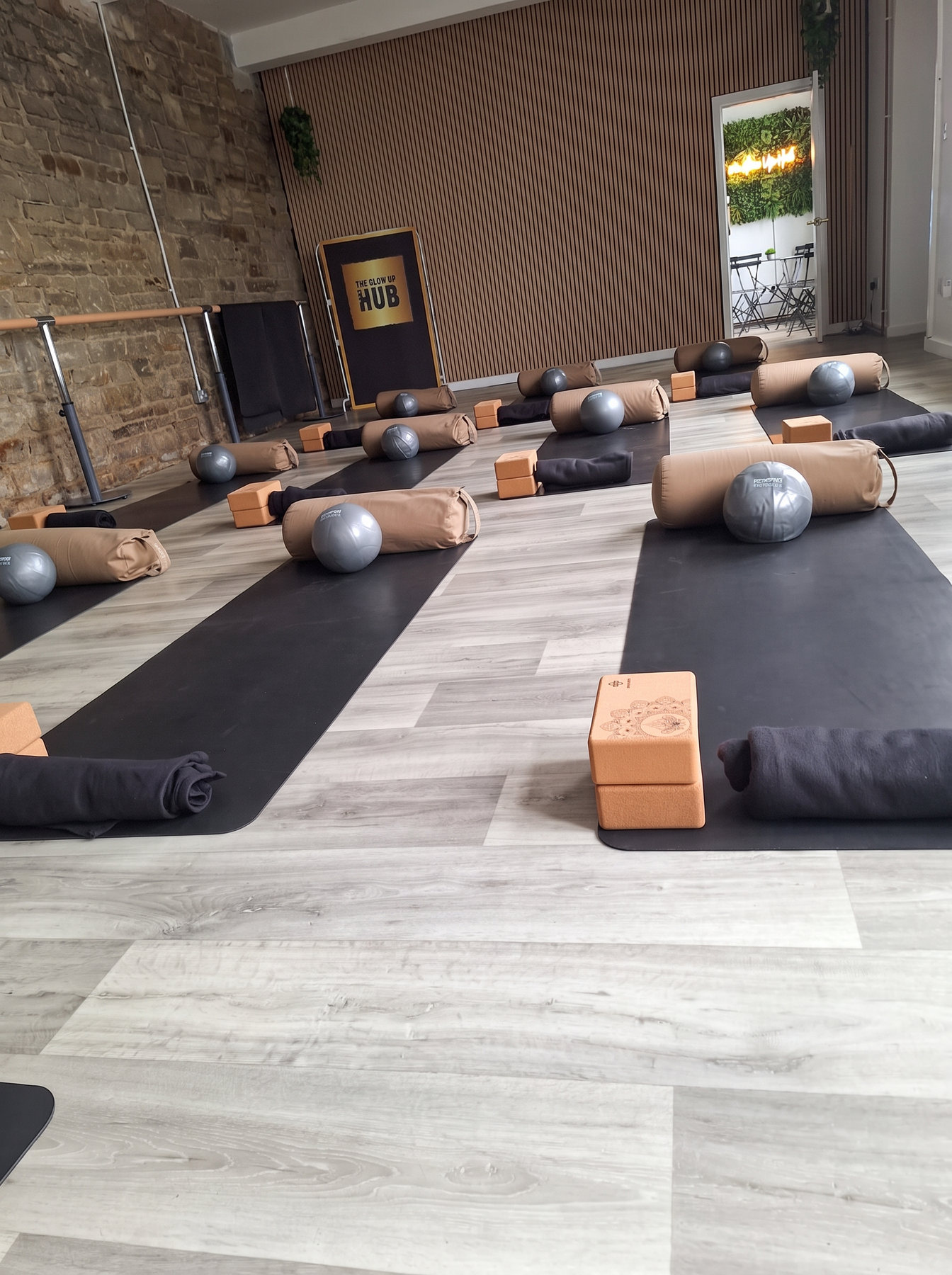 Mats and props prepared for a class at The Glow Up Hub